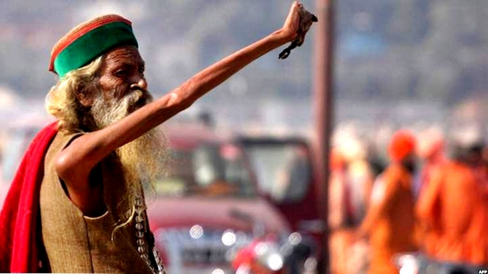 Amar Bharati with raised arm, demonstrating long-term atrophy