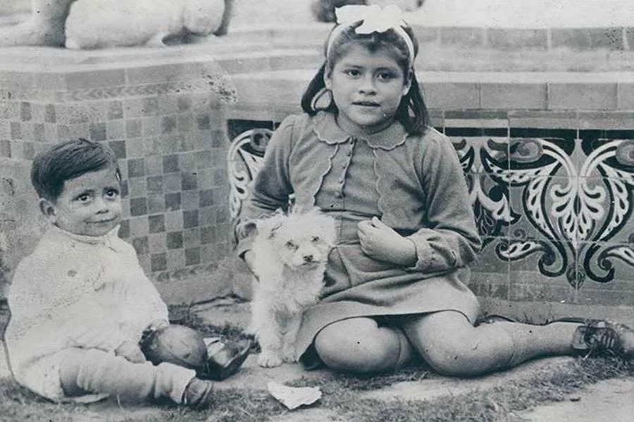 Lina Medina with her young son outdoors